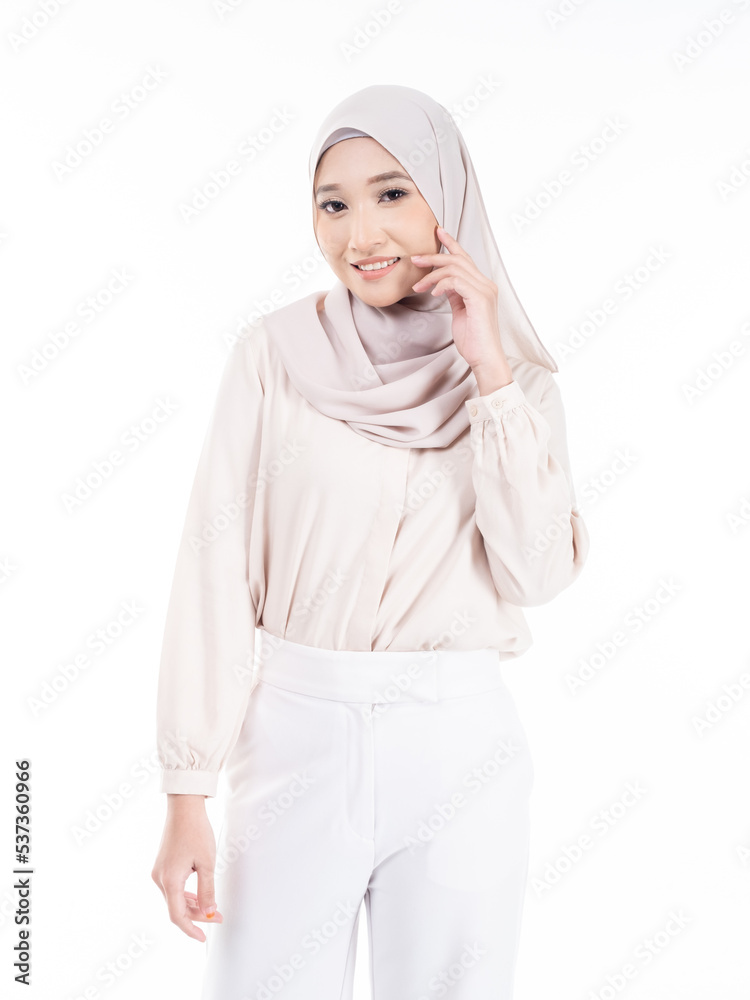 Portrait of Muslim woman in office attire and wearing a hijab. Asian woman in a corporate world. Formal corporate outfit and elegant appearance. Corporate or business people concept. Isolated Portrait of Muslim woman in office attire and wearing a hijab. Asian woman in a corporate world. Formal corporate outfit and elegant appearance. Corporate or business people concept. Isolated