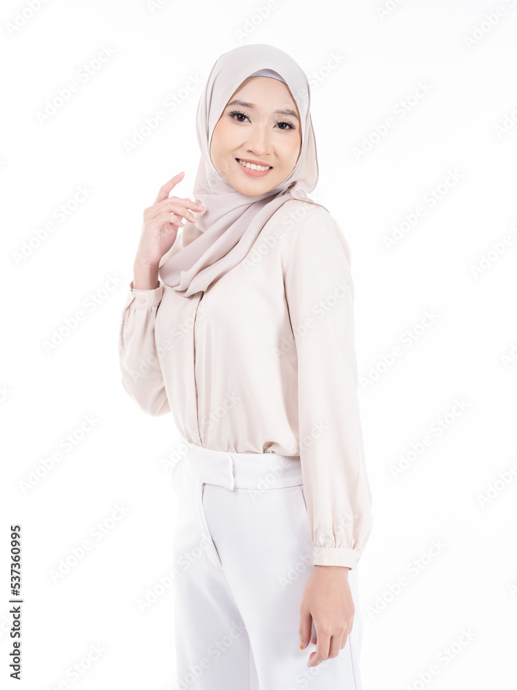 Portrait of Muslim woman in office attire and wearing a hijab. Asian woman in a corporate world. Formal corporate outfit and elegant appearance. Corporate or business people concept. Isolated Portrait of Muslim woman in office attire and wearing a hijab. Asian woman in a corporate world. Formal corporate outfit and elegant appearance. Corporate or business people concept. Isolated