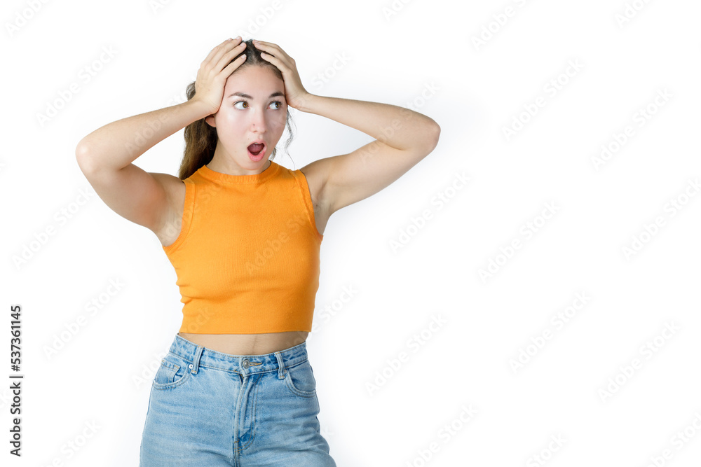 Portrait of surprised young woman with hands on head. Amazed young woman with opened mouth. Happiness and excitement concept Portrait of surprised young woman with hands on head. Amazed young woman with opened mouth. Happiness and excitement concept