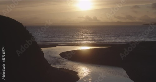 Beautiful sunset over the river mouth in Budleigh Salterton, Devon, UK. photo