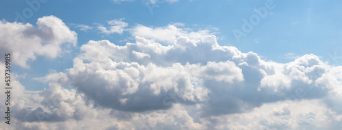 Illuminated by the bright sun, white clouds in the blue sky