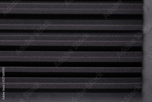 Acoustic soundproof foam at cement wall background texture. Sound isolation material for studio