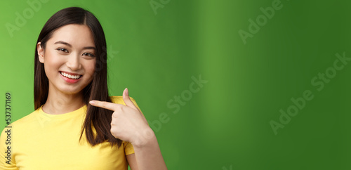 Close-up joyful proud asian assertive girl introduce herself, pointing own face smiling joyfully, boastful telling own achievement, bragging accomplishment, assure can deal with work