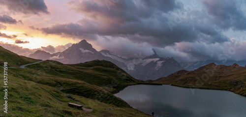 Colorful summer sunrise on Bachalpsee lake with Schreckhorn and Wetterhorn peaks on background. Picturesque morning scene in the Swiss Bernese Alps, Switzerland, Europe. © Tomas Bazant
