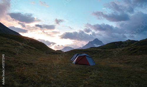 Camping Tent near Bachalpsee in the mountains of Switzerland, Night and Sunset in Swiss Alps