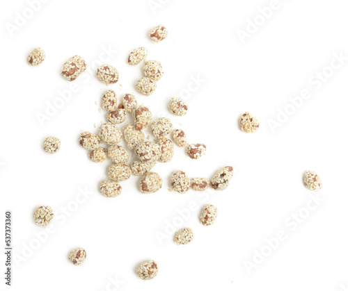 a handful of peanuts in sesame on white background