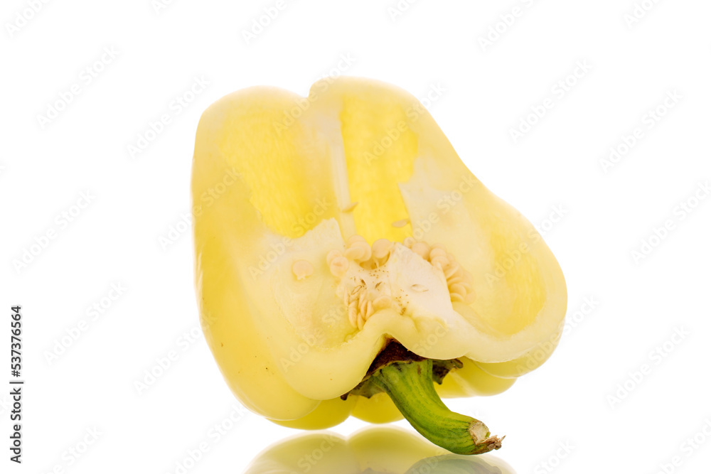 One half of fresh juicy sweet pepper, macro, isolated on white background. One half of fresh juicy sweet pepper, macro, isolated on white background.