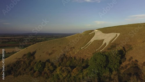 Flying past the Westbury White Horse.  A hill figure in the UK. Evening light photo