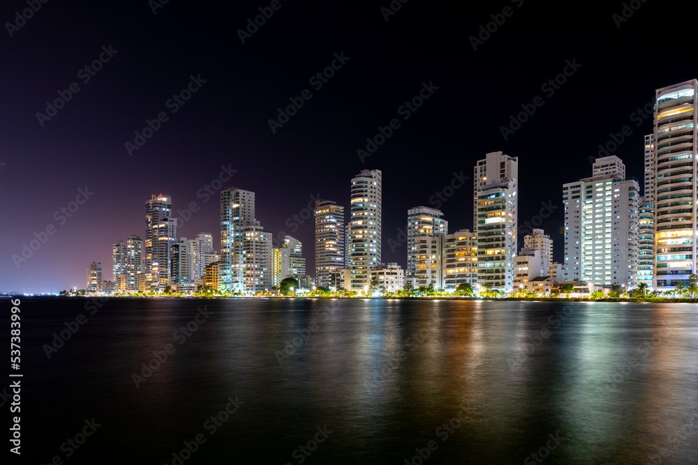 Buildings reflected in the sea at night in Castillogrande. Cartagena, Bolivar, Colombia. Buildings reflected in the sea at night in Castillogrande. Cartagena, Bolivar, Colombia.