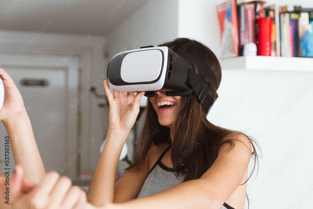 Group of female friends using virtual reality glasses Group of female friends using virtual reality glasses