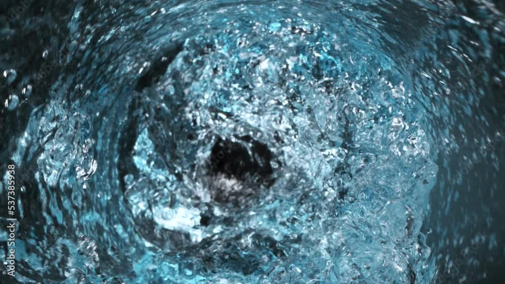 Super Slow Motion Shot of Water Vortex Splash on Black Background at 1000fps.