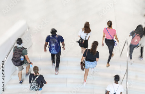 Blur of focus, people on the stairs in a public building
