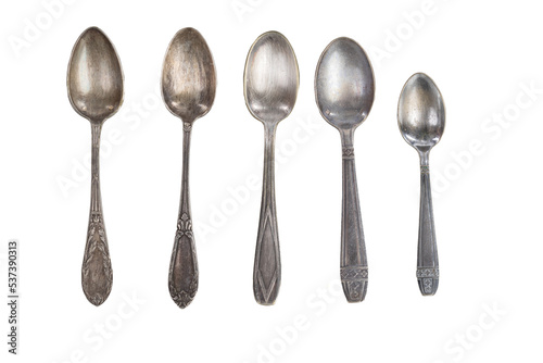 several antique silver spoons