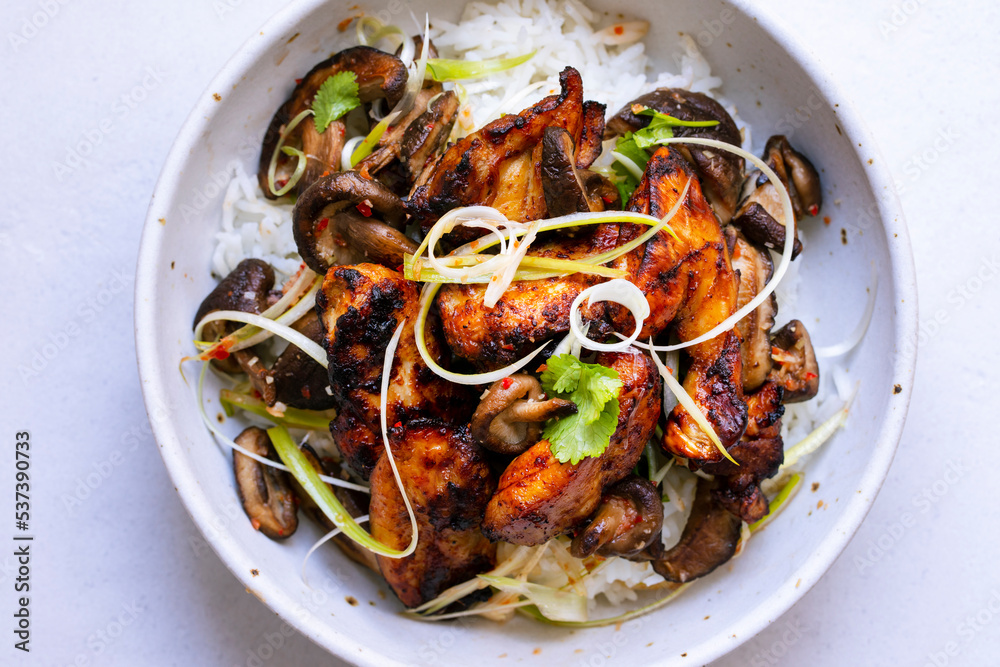 Rice with spicy chicken tighs, shiitake mushrooms and spring onions Rice with spicy chicken tighs, shiitake mushrooms and spring onions
