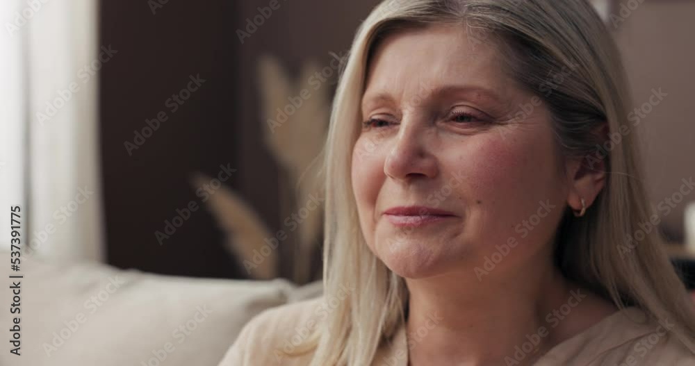 An elderly woman shrugged. Close-up on the face of the senior woman, who has tears in her eyes is surprised by the pleasant surprise, happy to receive the information. An elderly woman shrugged. Close-up on the face of the senior woman, who has tears in her eyes is surprised by the pleasant surprise, happy to receive the information.
