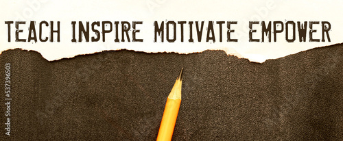 Εκτύπωση καμβά Open notebook with text Teach inspire motivate empower on wooden background