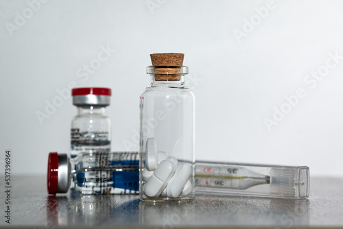 Medicines for the treatment of the pandemic on a wooden table.