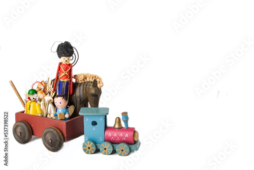 Wooden vintage Christmas toys and gifts on a white background.