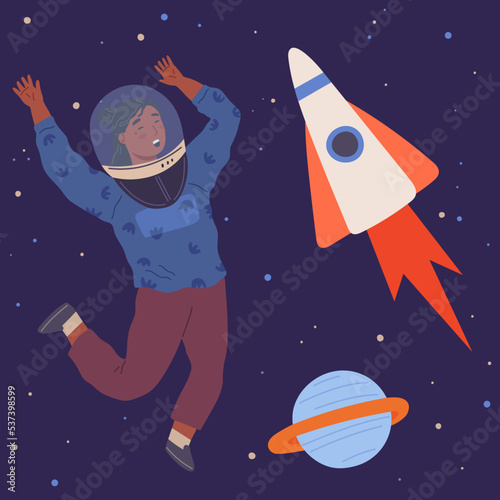 Child astronaut in cardboard or plastic rocket outfit dreams about space. Creative boy in self made costume imagines flying in sky. Kid playing space explorer. Guy in costume near huge rocket