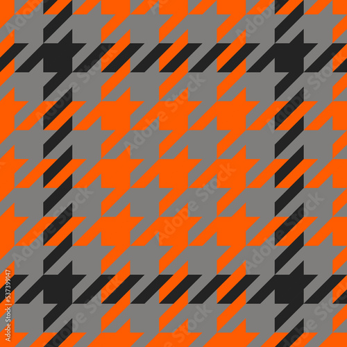 Goose foot. Halloween Pattern of crow is feet in orange, black and gray cage. Glen plaid. Houndstooth tartan tweed. Dogs tooth. Scottish cage. Seamless fabric texture. Vector illustration