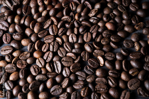 Coffee beans fill the frame background. Suitable for advertising background