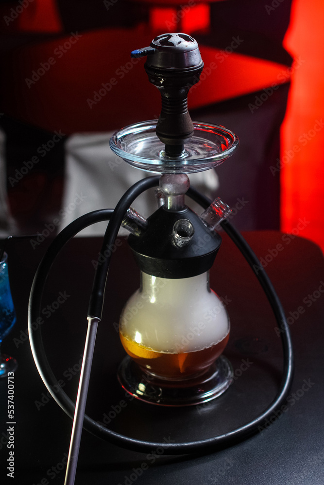hookah bright with smoke beautiful is on the table in the club or bar lit hookah bright with smoke beautiful is on the table in the club or bar lit