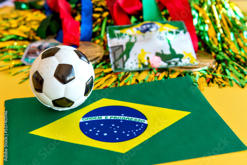 Items from the brazilian fans on yellow background, World Cup fan itens.