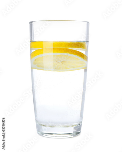 Glass with water and sliced lemon on white background