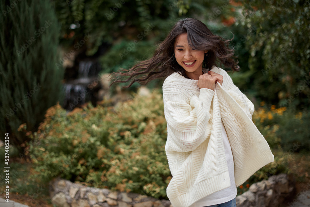 Beautiful asian kazakh brunette woman with flying long hair Beautiful asian kazakh brunette woman with flying long hair