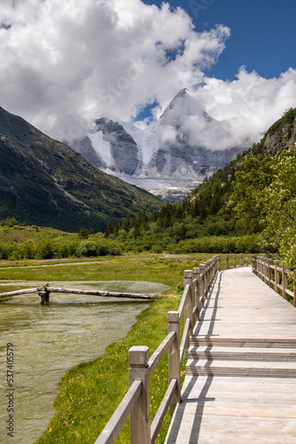 Vertical image of the wooden walkway in Yading national level reserve, Daocheng, Sichuan Province, China.