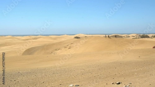 wind blowing sand on sand dunes near the sea in Maspalomas, Gran Canaria