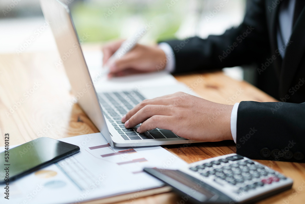 Businessman working at office using laptop. Businessman working at office using laptop.