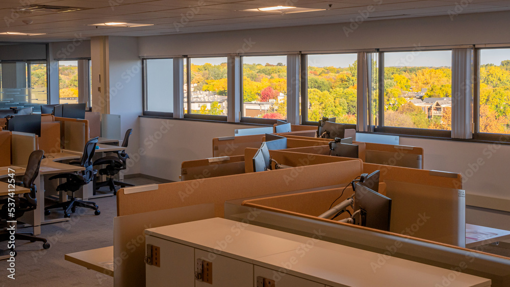 Working space with office supplies and wide window with beautiful autumn landscape Working space with office supplies and wide window with beautiful autumn landscape