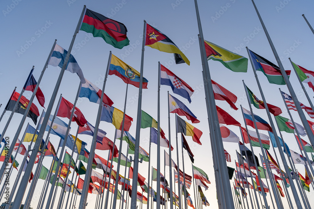 Flags of the different countries against the blue sky Flags of the different countries against the blue sky