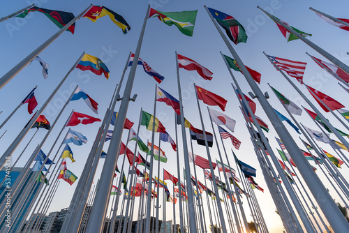 Fotografie Flags of the different countries against the blue sky