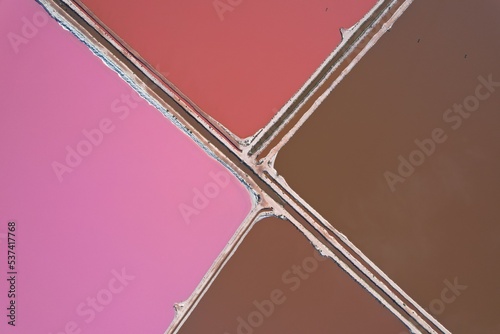 Pink lake drone picture. Salty lakes with amazing colors, brown and pink in Western Australia. Hutt Lagoon. Geometric shapes.