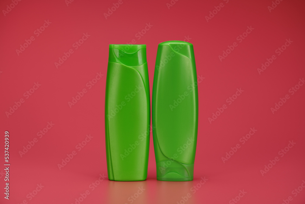Blank Label Shampoo Green Bottle or Shower Gel on Pink Background Blank Label Shampoo Green Bottle or Shower Gel on Pink Background