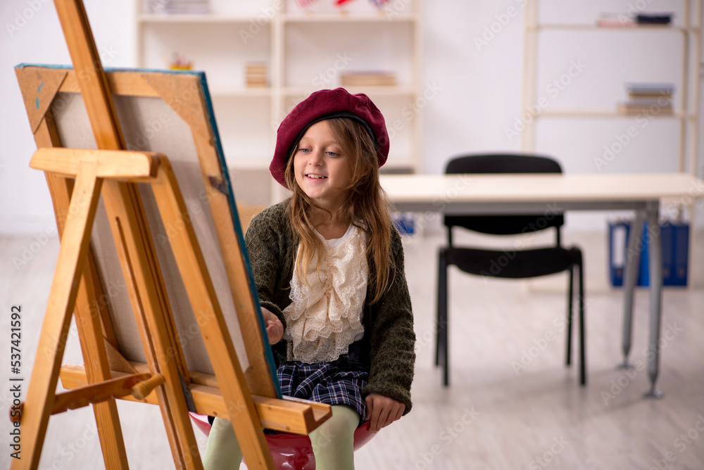 Young little girl enjoying painting at home Young little girl enjoying painting at home
