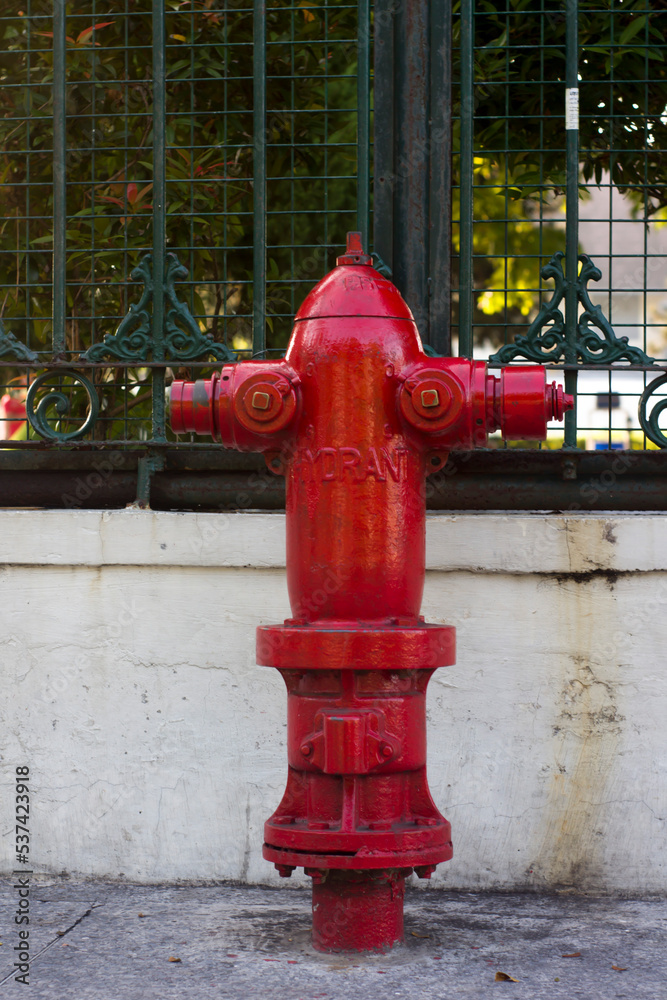 Close-Up Of Fire Hydrant At Sidewalk. Red fire hydrant Close-Up Of Fire Hydrant At Sidewalk. Red fire hydrant