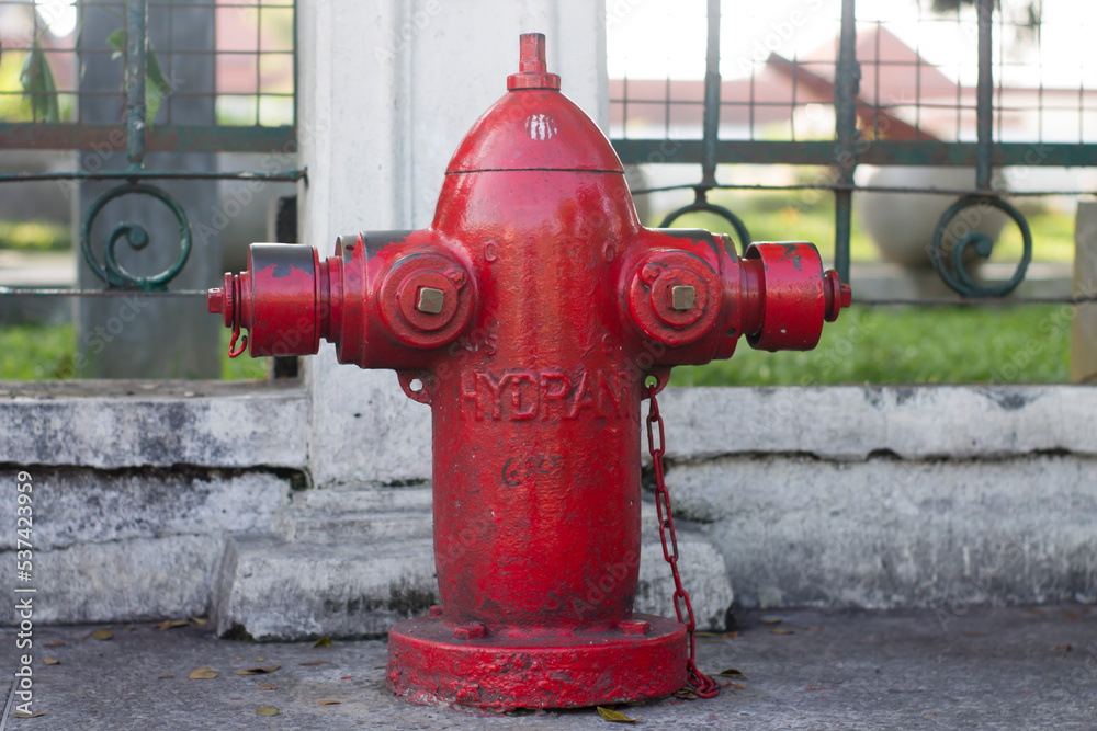 Close-Up Of Fire Hydrant At Sidewalk. Red fire hydrant Close-Up Of Fire Hydrant At Sidewalk. Red fire hydrant