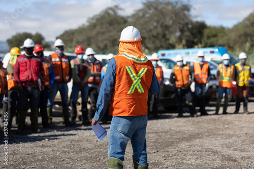 manager or the leading team is assigning a job for the team of technicians, supervisor, foreman and engineers in the morning meeting before work out in the field