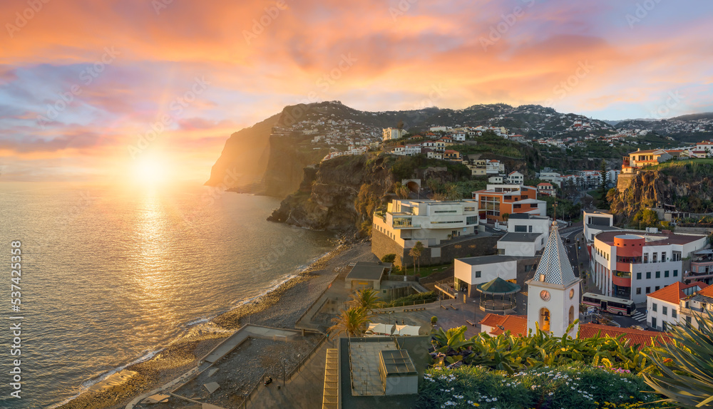 Camara de Lobos village at sunset, Cabo Girao in background, Madeira island, Portugal