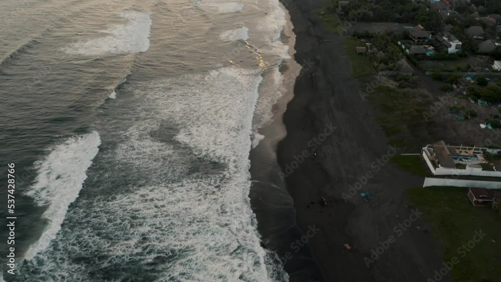 Flying Over Black Sand Beach In El Paredon, Guatemala During Sunset - drone shot Flying Over Black Sand Beach In El Paredon, Guatemala During Sunset - drone shot