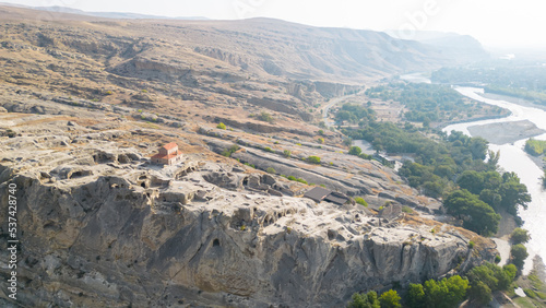 Archaeological site with the remains of a rock-cut settlement dating back to the Iron Age.