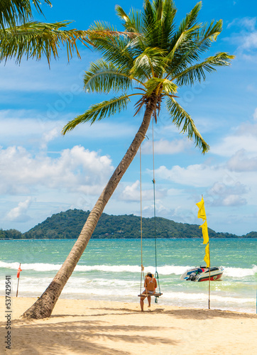 Phuket, Thailand - 27 September 2022: Colorful, sunny beach in Patong. Patong beach is the most popular beach in Phuket Island.