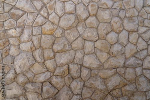 Stone wall, interestingly textured natural stone wall. Copy space for your design or product. Web banner.