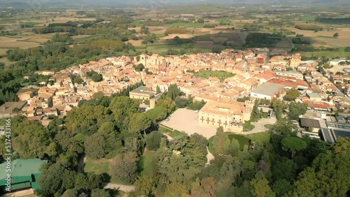 Aerial image of the city of Peralada in Girona Costa Brava small medieval town walking away from the city photo