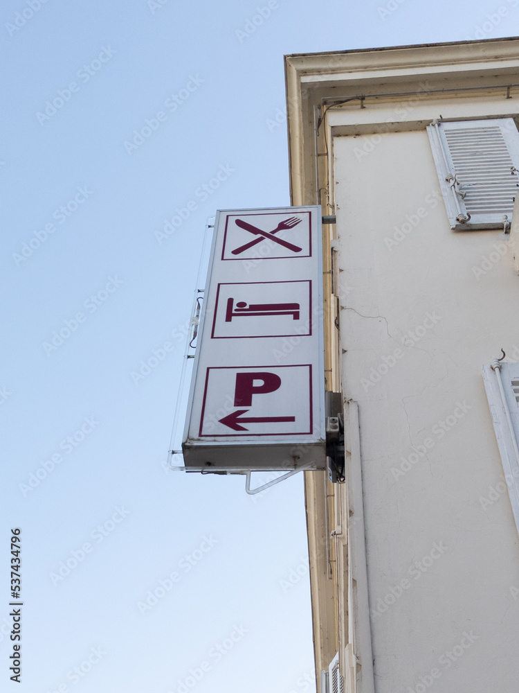 restaurant hotel signboard icon logo sign on wall facade entrance in city street restaurant hotel signboard icon logo sign on wall facade entrance in city street