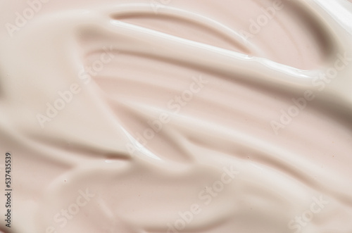 A sample of moisturizer on a pink background. Cosmetic product for the skin.
