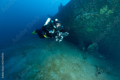 Sub con rebreather e stages di fianco al relitto della corvetta Gazzella, affondata nel golfo dell'Asinara, Sardegna photo